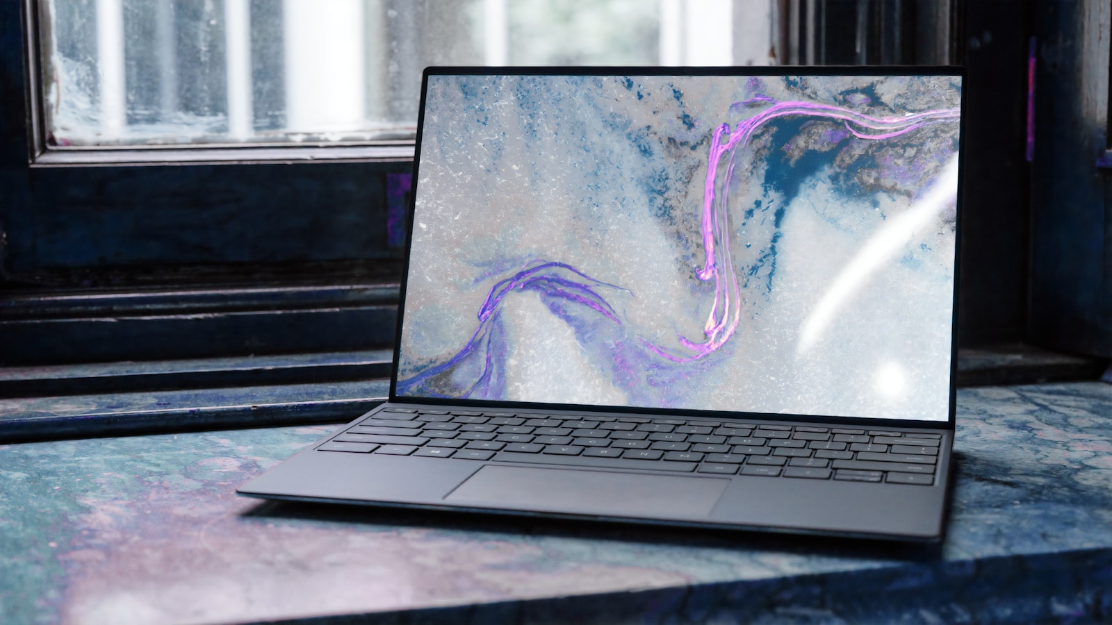 Laptop set up for secure remote work by a window